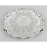 A Victorian silver round salver with shaped scrolling rim,