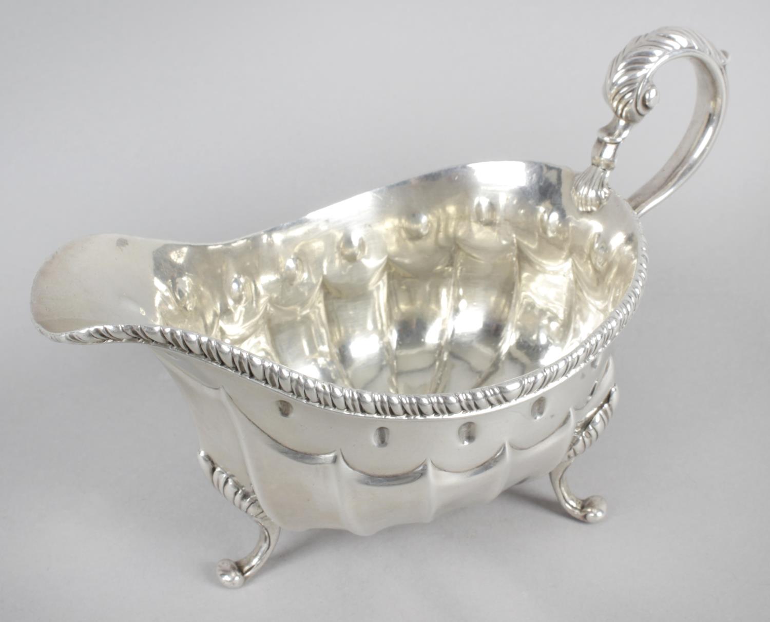 A late George III silver sauce boat,