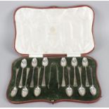 Four cased sets of tea and coffee spoons - a set of twelve teaspoons and tongs in a fitted case by