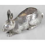 A 1920's silver mounted novelty pin cushion, modelled as a hare or rabbit with fur detailing.