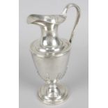 A modern silver claret jug,