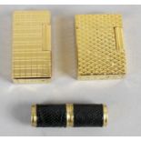 A Dupont gold plated cigarette lighter of hinged rectangular form,
