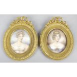 A pair of 19th century oval painted portrait miniatures upon ivory panels,