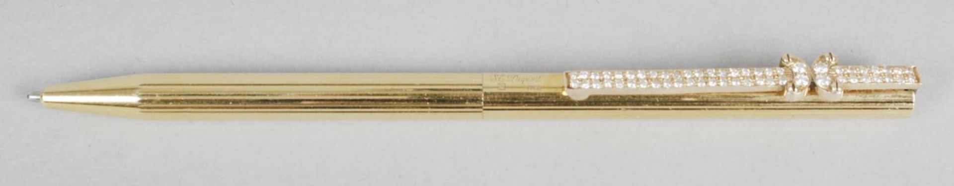 An S.T. Dupont gold plated propelling ball point pen,
