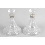 A pair of cut glass decanters and stoppers,