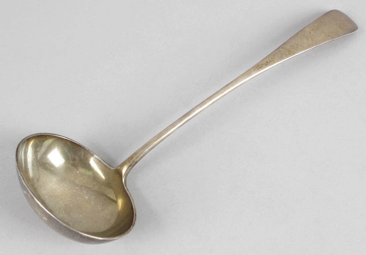 A Victorian silver Old English pattern soup ladle.