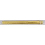 A Must De Cartier gold plated cased ball point pen with vertical engine turned decoration,