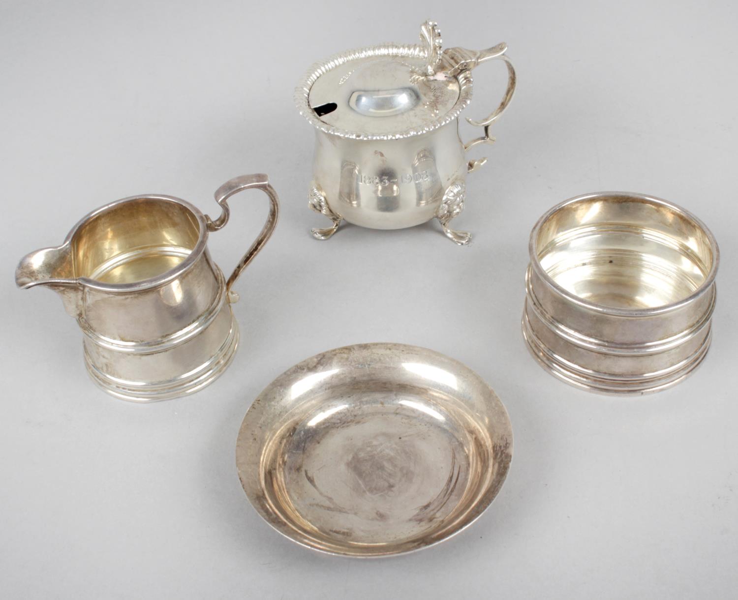 A 1920's Scottish silver small cream jug and matching sugar bowl,