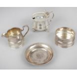 A 1920's Scottish silver small cream jug and matching sugar bowl,