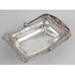 An Edwardian silver swing handle basket of rectangular shape,