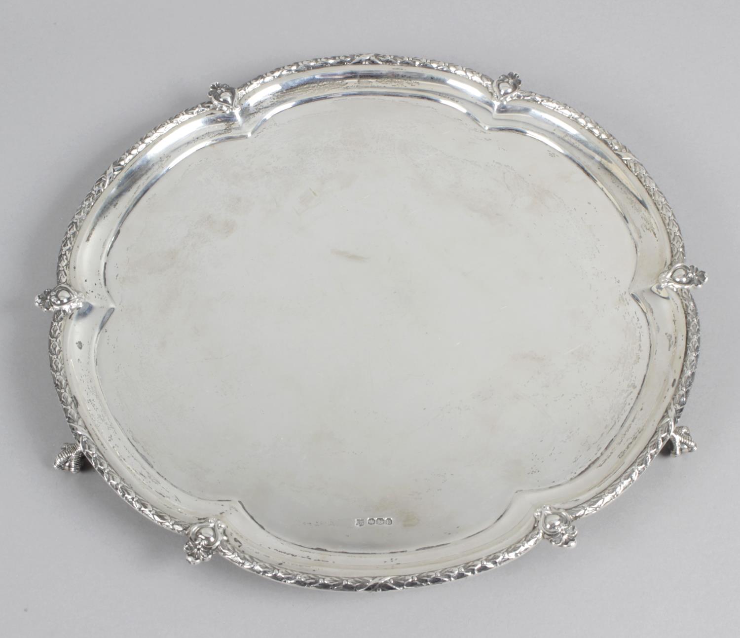 A 1920's silver salver of hexafoil form,