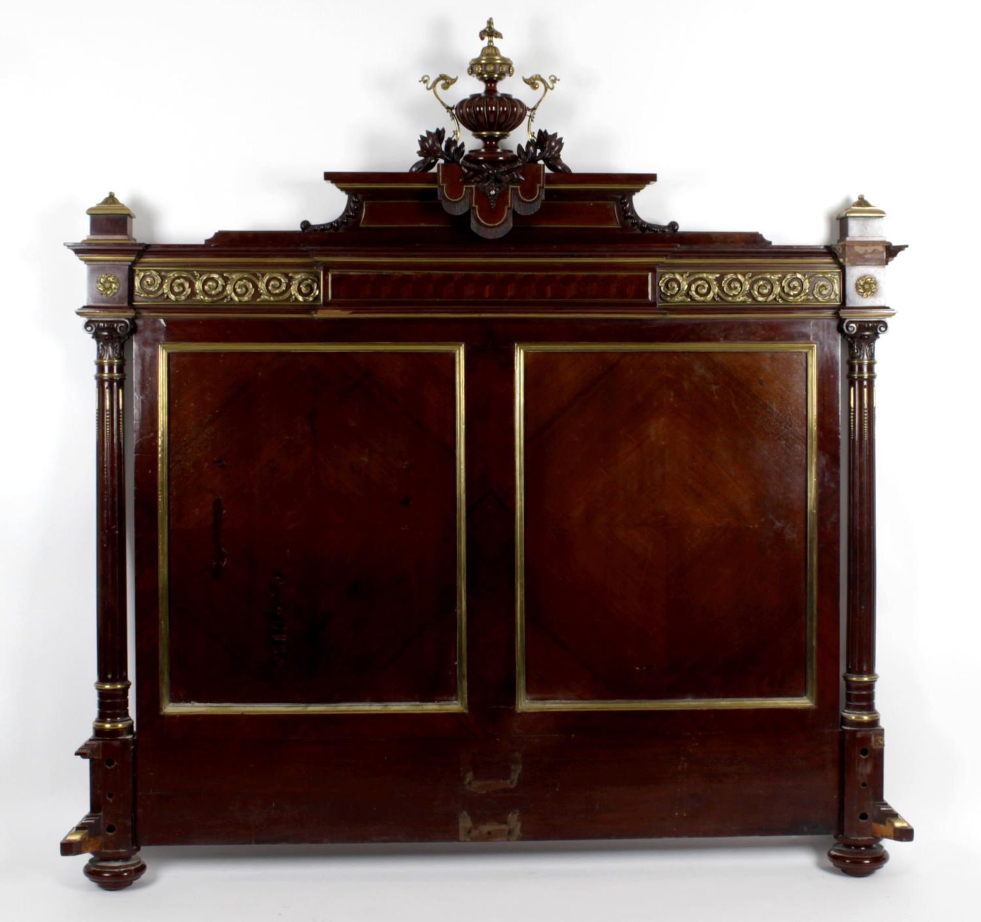 An early 20th century mahogany veneered double bed,