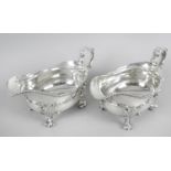 A fine pair of late George III silver sauce boats,