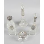 A selection of silver mounted or lidded glass dressing table bottles and jars,