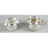 Two silver twin-handled bowls - both of plain form.