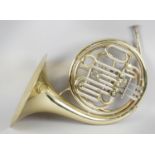 A French horn, engraved with maker's detail 'Sterling' in fitted case,
