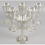 A set of six modern silver wine goblets with plain bowls standing on turned bulbous columns and a