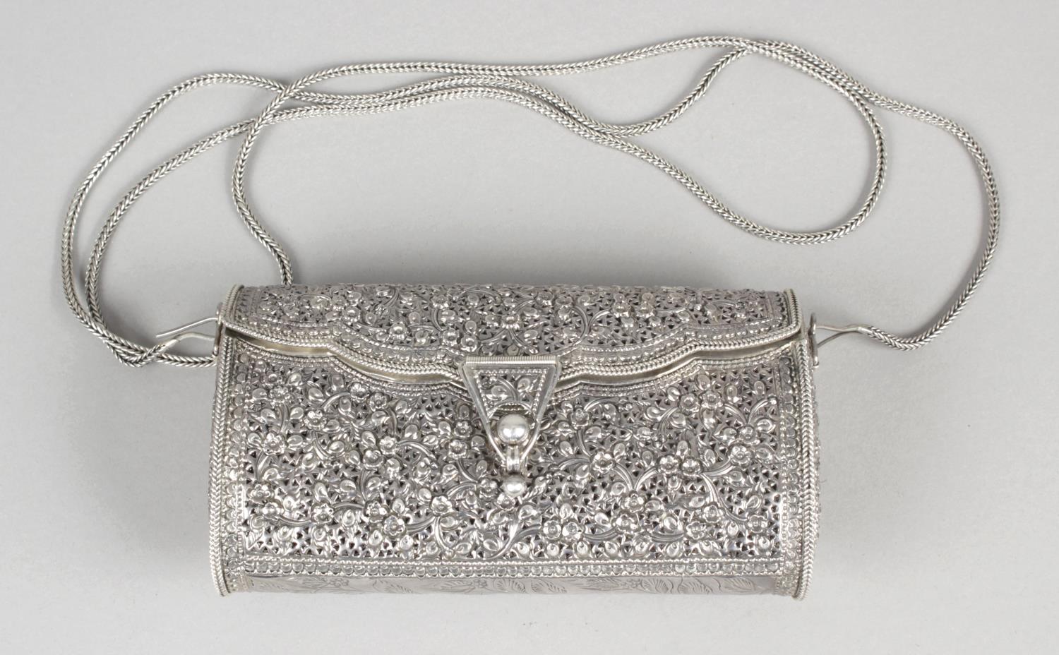 A small silver clutch bag,