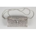 A small silver clutch bag,