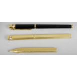 A Must de Cartier gold plated cased ball point pen with vertical engine turned decoration,