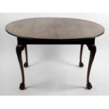 A late 19th century oval topped wind out extending dining room table,
