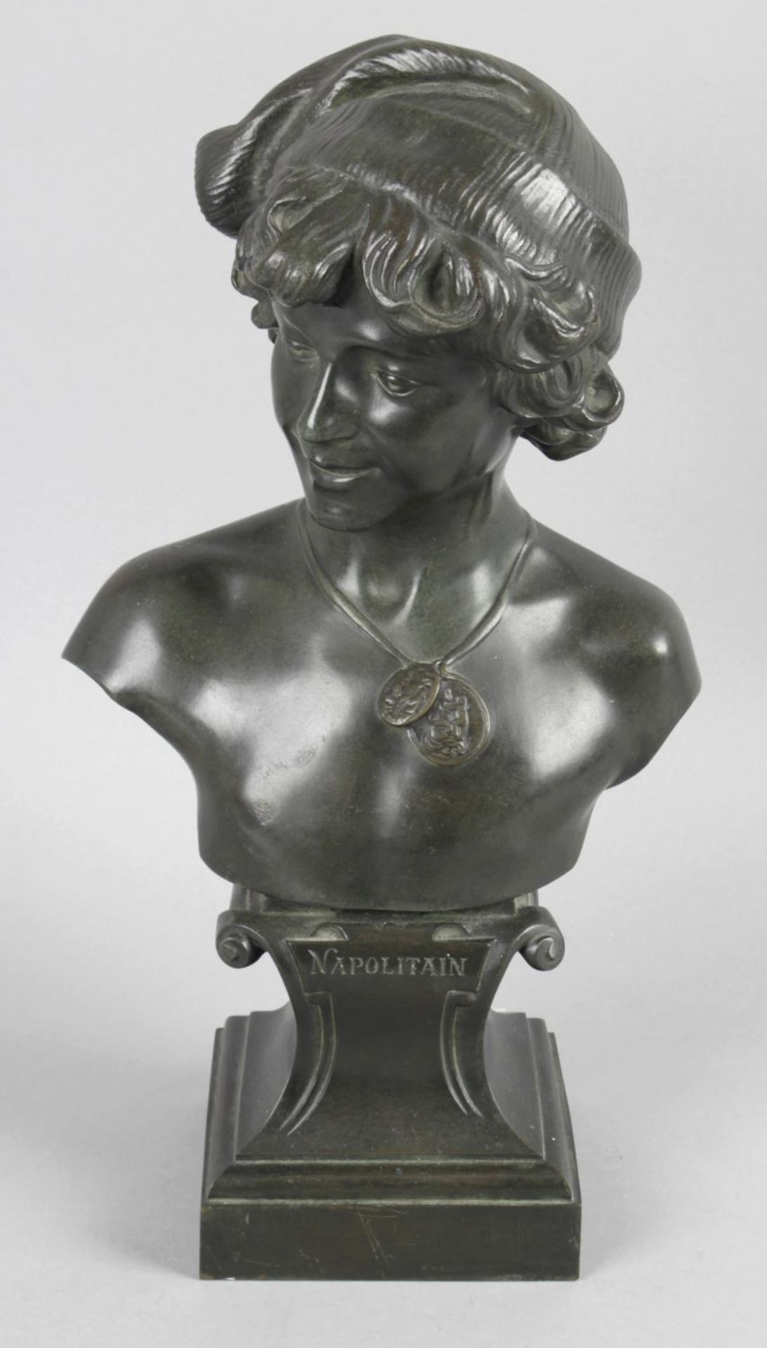 After Alp-de-Tombay - a late 19th century bronze head and shoulder bust modelled as a young male