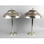 A pair of 20th century silvered table lamps,