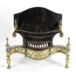 A cast iron and brass fire basket,