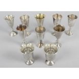 A selection of ten assorted small silver kiddush cups,