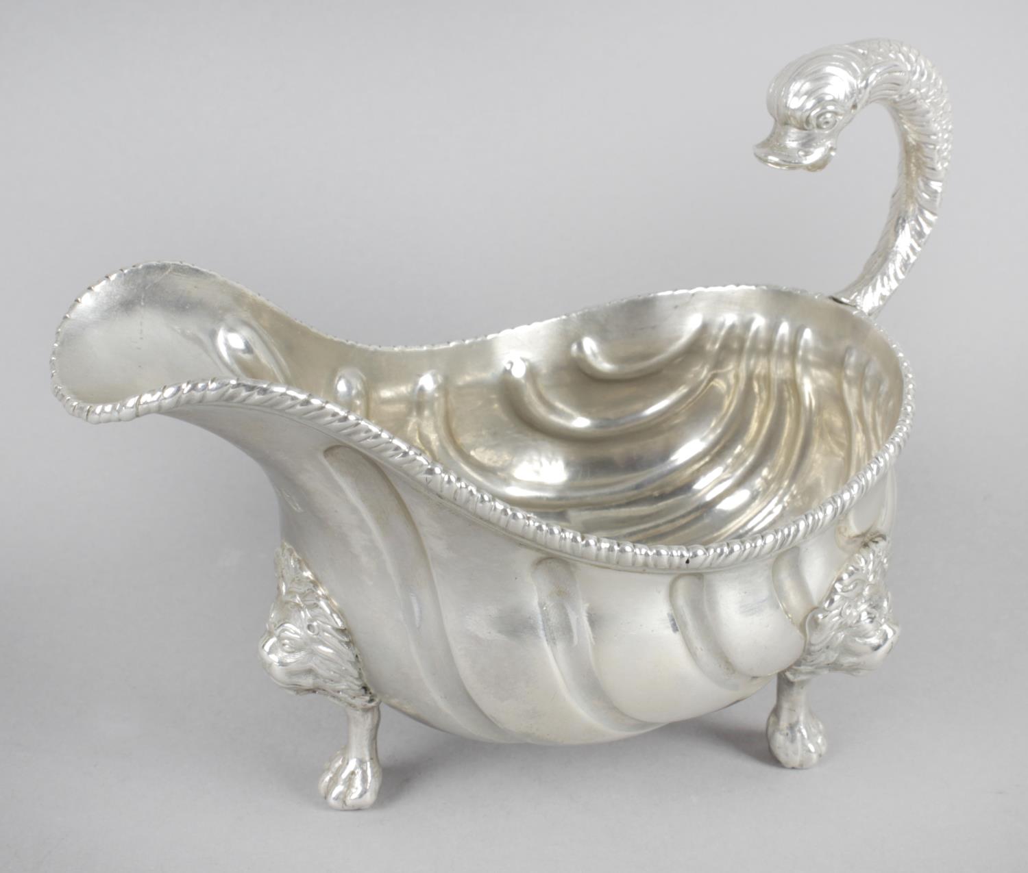 A George II silver sauce boat,