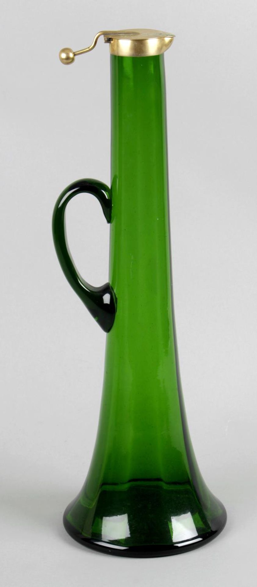 A Victorian green glass claret jug,