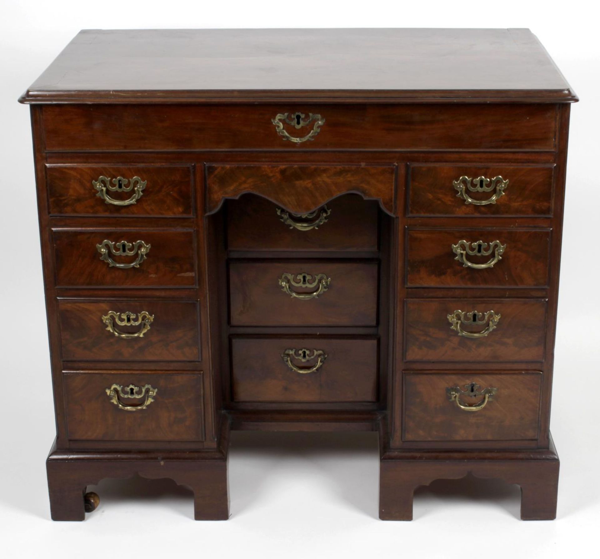 A George III mahogany kneehole desk or dressing table,