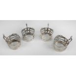 A set of four George V silver cup holders,