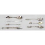 A small collection of silver cutlery to include two pickle forks,