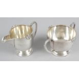 Art Deco style strawberry set of cream jug and sugar bowl of bulbous shape with applied motif to