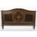 An early twentieth century mahogany marquetry inlaid double bed,
