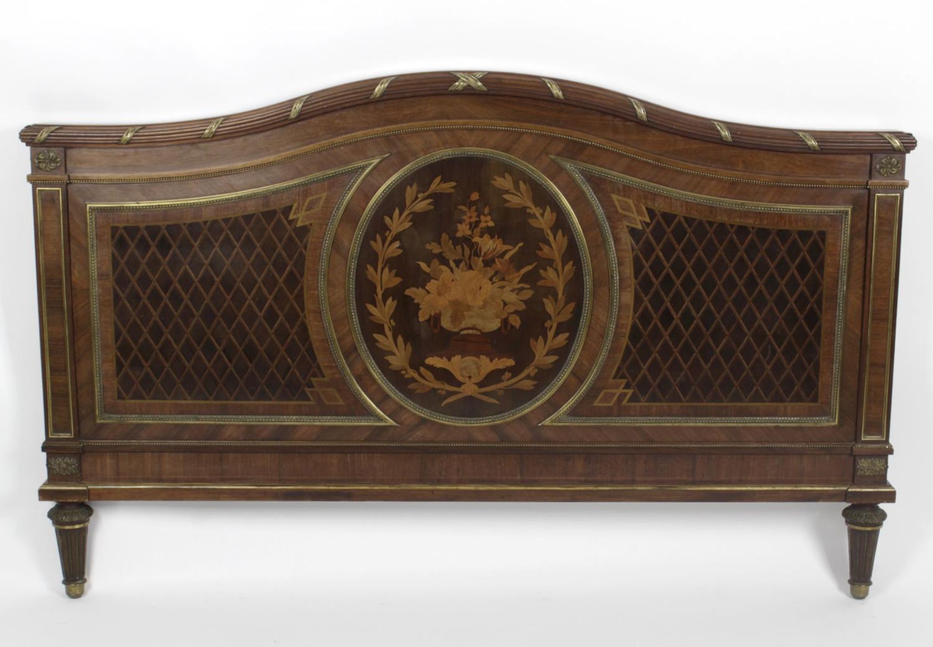 An early twentieth century mahogany marquetry inlaid double bed,