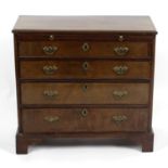 A small 19th century mahogany and walnut veneered chest,
