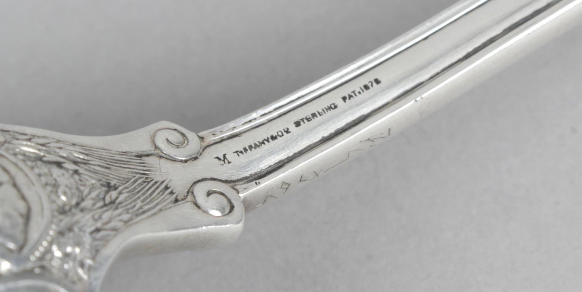 A Tiffany & Co sterling silver crumber in Olympian pattern, - Image 2 of 2