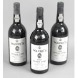A selection of assorted bottles of port,