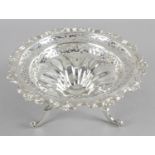 An Edwardian silver raised pierced bowl within an acanthus shaped rim and pierced floral decoration