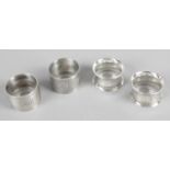 Two pairs of silver napkin rings.