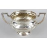 A large twin-handled pedestal bowl,