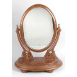A 19th century mahogany framed oval swing toilet mirror,