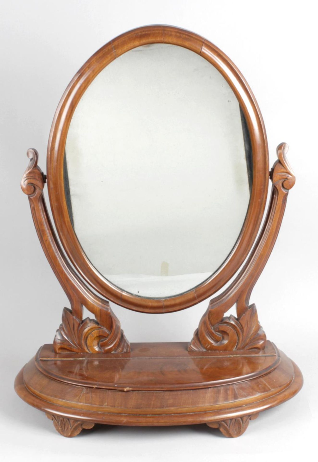 A 19th century mahogany framed oval swing toilet mirror,