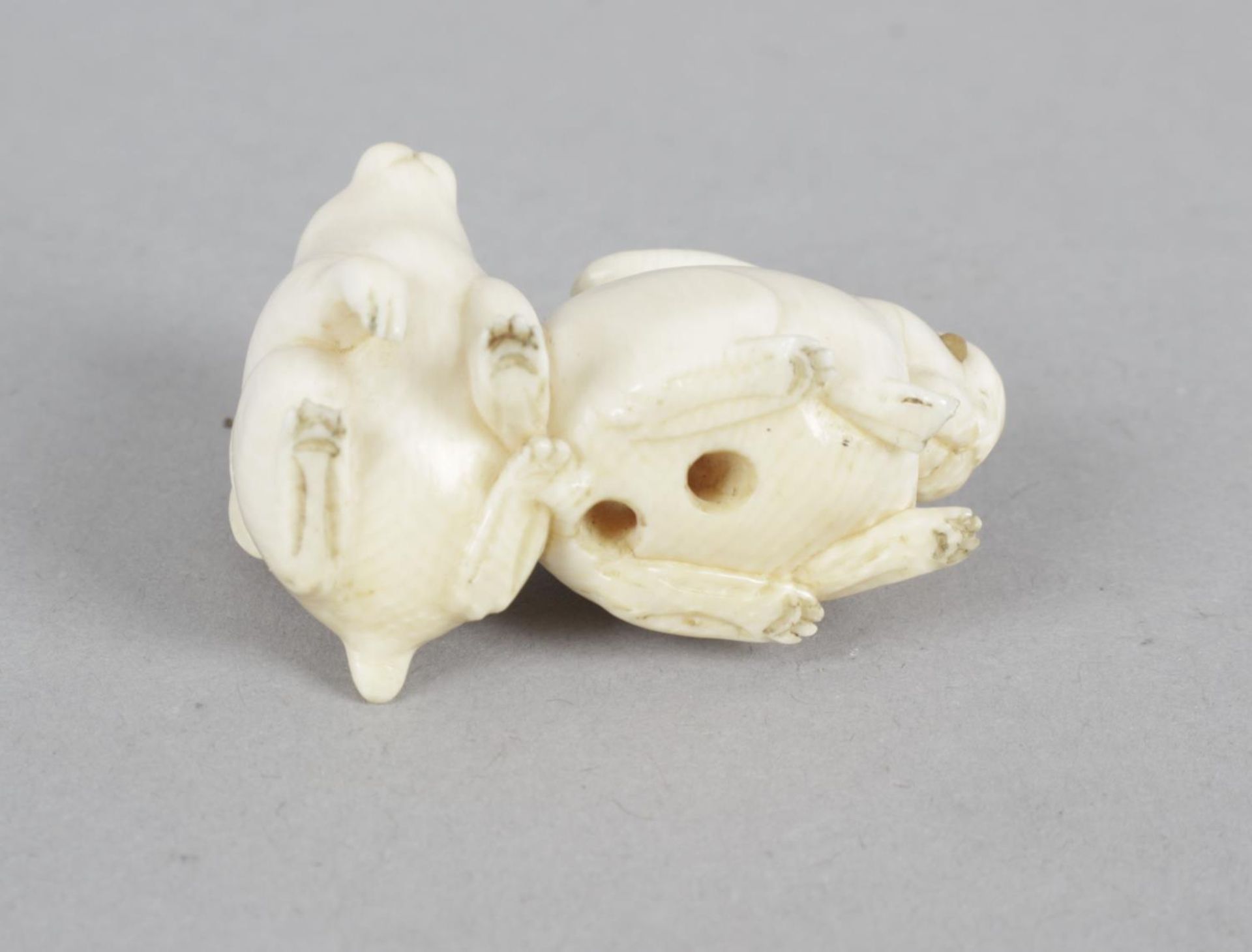 A late 19th century carved ivory netsuke modelled as two rabbits. - Bild 2 aus 2