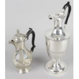 A late Victorian silver lidded jug or ewer,