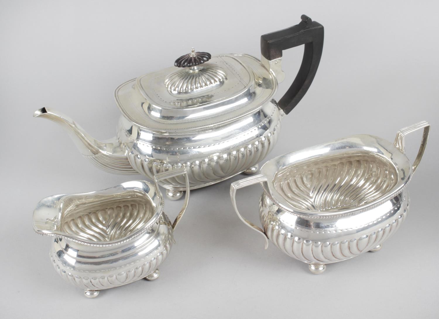 A late Victorian silver three piece tea service,