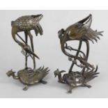 A pair of Oriental bronze animalier figures,