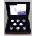 Elizabeth II, seventeen Crownsize sterling silver coins commemorating Elizabeth II's eightieth